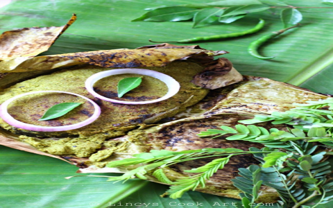 Steamed Fish in Kerala Style: Traditional Meen Pollichathu with Banana Leaves